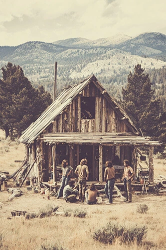 Philosophical origins of tiny house living: Friends building a small cabin in the mountains