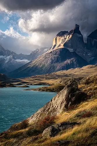 Torres del Paine National Park in Patagonia, Chile. The iconic granite towers rising dramatically above turquoise glacial lakes, rugged mountains and wide open valleys.