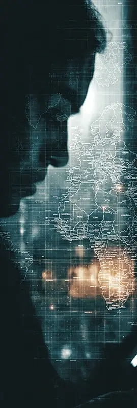 a person at night illuminated only by a smartphone screen, the reflection of a world map and news from different continents visible on the screen